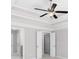 Serene bedroom featuring a tray ceiling, a ceiling fan, and a neutral color palette for a relaxing retreat at 333 Gardens Of Harmony Dr, Canton, GA 30115