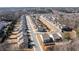 Aerial view of a well-maintained neighborhood with neat rows of single-Gathering homes and tree-lined streets at 333 Gardens Of Harmony Dr, Canton, GA 30115