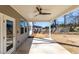 Covered patio with a ceiling fan and clear view into the backyard at 333 Gardens Of Harmony Dr, Canton, GA 30115