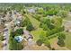 Aerial view of a single Gathering home on sprawling acreage with mature trees at 3919 Evans Rd, Cumming, GA 30040