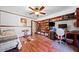 Inviting bedroom with hardwood floors, built-in storage, and a ceiling fan at 3919 Evans Rd, Cumming, GA 30040