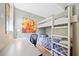 Shared bedroom with a bunk bed, desk, and an eye-catching piece of artwork at 3919 Evans Rd, Cumming, GA 30040
