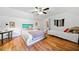 Spacious bedroom with hardwood floors, two beds, and ample lighting at 3919 Evans Rd, Cumming, GA 30040