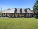 Charming single-story home with dormer windows, a well-maintained lawn, and inviting curb appeal at 3919 Evans Rd, Cumming, GA 30040