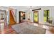 Inviting foyer with wood floors, staircase, and stylish decor at 3919 Evans Rd, Cumming, GA 30040