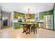 The green cabinets and stainless appliances add flair to this eat-in kitchen at 3919 Evans Rd, Cumming, GA 30040