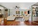 Inviting living room with hardwood floors and an open layout to the kitchen at 3919 Evans Rd, Cumming, GA 30040