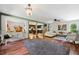 Spacious living room with hardwood floors and an open flow to the kitchen at 3919 Evans Rd, Cumming, GA 30040