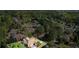 Aerial view of the home and surrounding neighborhood with lush trees, close to Sawnee Mountain Park at 6690 Stillmeadow Dr, Cumming, GA 30040