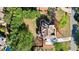 Aerial perspective of a home with a well-maintained roof, private backyard, and mature landscaping at 6690 Stillmeadow Dr, Cumming, GA 30040