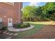 The home features a serene backyard with stone pathway and lush landscaping at 6690 Stillmeadow Dr, Cumming, GA 30040