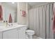 Bathroom featuring a vanity with a sink, a shower and a striped curtain at 6690 Stillmeadow Dr, Cumming, GA 30040