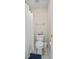 Compact bathroom featuring a toilet, shower with curtain, and tiled flooring at 6690 Stillmeadow Dr, Cumming, GA 30040