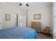 Comfortable bedroom featuring a ceiling fan and neutral decor at 6690 Stillmeadow Dr, Cumming, GA 30040
