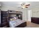Charming bedroom featuring a bunkbed, dresser and a window with natural light at 6690 Stillmeadow Dr, Cumming, GA 30040