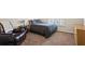 Carpeted bedroom with a leather recliner, a bed and window with natural light at 6690 Stillmeadow Dr, Cumming, GA 30040
