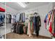 This walk-in closet has ample storage space with racks and shelving at 6690 Stillmeadow Dr, Cumming, GA 30040