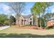 Stunning two-story brick home with a well-manicured lawn and charming curb appeal at 6690 Stillmeadow Dr, Cumming, GA 30040