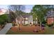 Two-story home boasts manicured landscaping, brick and siding exterior, and a welcoming entrance at 6690 Stillmeadow Dr, Cumming, GA 30040