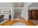 Grand foyer with hardwood floors, high ceilings, staircase, and natural light at 6690 Stillmeadow Dr, Cumming, GA 30040