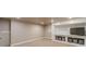 Basement room with built-in shelving unit and space for storage with a modern shelving unit and neutral decor at 255 Sageglen Rd, Lawrenceville, GA 30044