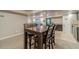 Finished basement with a wooden dining table near a living area that provides ample space for gathering and entertaining at 255 Sageglen Rd, Lawrenceville, GA 30044