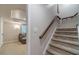Finished basement with carpeted stairs and a comfortable seating area at 255 Sageglen Rd, Lawrenceville, GA 30044