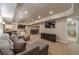Finished basement with seating, a fireplace, and a wet bar at 255 Sageglen Rd, Lawrenceville, GA 30044