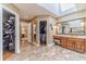 Bathroom with double sink vanity, walk-in closets, and tile floors at 255 Sageglen Rd, Lawrenceville, GA 30044