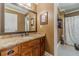 Bathroom boasts granite countertops and a shower-tub combination at 255 Sageglen Rd, Lawrenceville, GA 30044