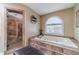 Soaking tub with tile surround and walk-in shower at 255 Sageglen Rd, Lawrenceville, GA 30044