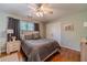 Charming bedroom features hardwood floors, soft light, and a ceiling fan at 255 Sageglen Rd, Lawrenceville, GA 30044