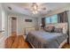 Spacious bedroom with a ceiling fan, hardwood floors, and lots of light at 255 Sageglen Rd, Lawrenceville, GA 30044