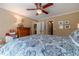 Cozy bedroom features a ceiling fan, neutral walls, and closet access at 255 Sageglen Rd, Lawrenceville, GA 30044
