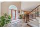 Inviting foyer featuring stone floors, a beautiful front door, and a staircase at 255 Sageglen Rd, Lawrenceville, GA 30044