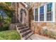 Charming front porch with stone accents and manicured landscaping at 255 Sageglen Rd, Lawrenceville, GA 30044