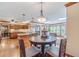 A spacious kitchen boasts hardwood floors, wooden cabinetry, granite countertops, and a breakfast nook at 255 Sageglen Rd, Lawrenceville, GA 30044