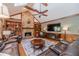 Spacious living room boasts a stone fireplace, built-in bookshelves, and vaulted ceilings with wood trim at 255 Sageglen Rd, Lawrenceville, GA 30044