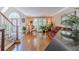Living room with hardwood floors, staircase, and ample natural light at 255 Sageglen Rd, Lawrenceville, GA 30044