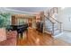 Living room featuring hardwood floors with view of the staircase and dining area at 255 Sageglen Rd, Lawrenceville, GA 30044