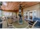 Cozy screened porch featuring a ceiling fan, patio table, and access to the home's interior at 255 Sageglen Rd, Lawrenceville, GA 30044