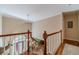 Inviting staircase with wood railing and trim leads to a view of the front door at 255 Sageglen Rd, Lawrenceville, GA 30044