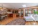 Sunroom with hardwood floors, multiple windows, and a seating area at 255 Sageglen Rd, Lawrenceville, GA 30044