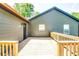 New back deck with a view of the home's exterior and the back yard at 3244 Mount Olive Rd, Atlanta, GA 30344