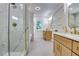 Bright bathroom features stylish double vanity, white marble finishes, gold fixtures, and glass shower at 3244 Mount Olive Rd, Atlanta, GA 30344