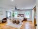 Light bedroom with hardwood floors and a sliding barn door to the ensuite bath at 3244 Mount Olive Rd, Atlanta, GA 30344