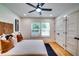 Inviting bedroom with king bed, hardwood floors, ceiling fan, and a large closet at 3244 Mount Olive Rd, Atlanta, GA 30344