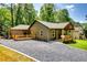 Beautifully designed home with stylish exterior, inviting porch, and modern landscaping at 3244 Mount Olive Rd, Atlanta, GA 30344