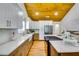 Modern kitchen featuring white cabinetry, stainless steel appliances, and a stylish island at 3244 Mount Olive Rd, Atlanta, GA 30344