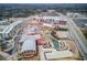 Comprehensive aerial view of the entire community, showcasing the diverse mix of residential and commercial buildings at 4414 Aldenham Way, Suwanee, GA 30024